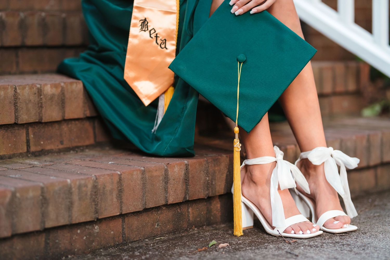 Detail shots of formal wear and shoes on brick steps.