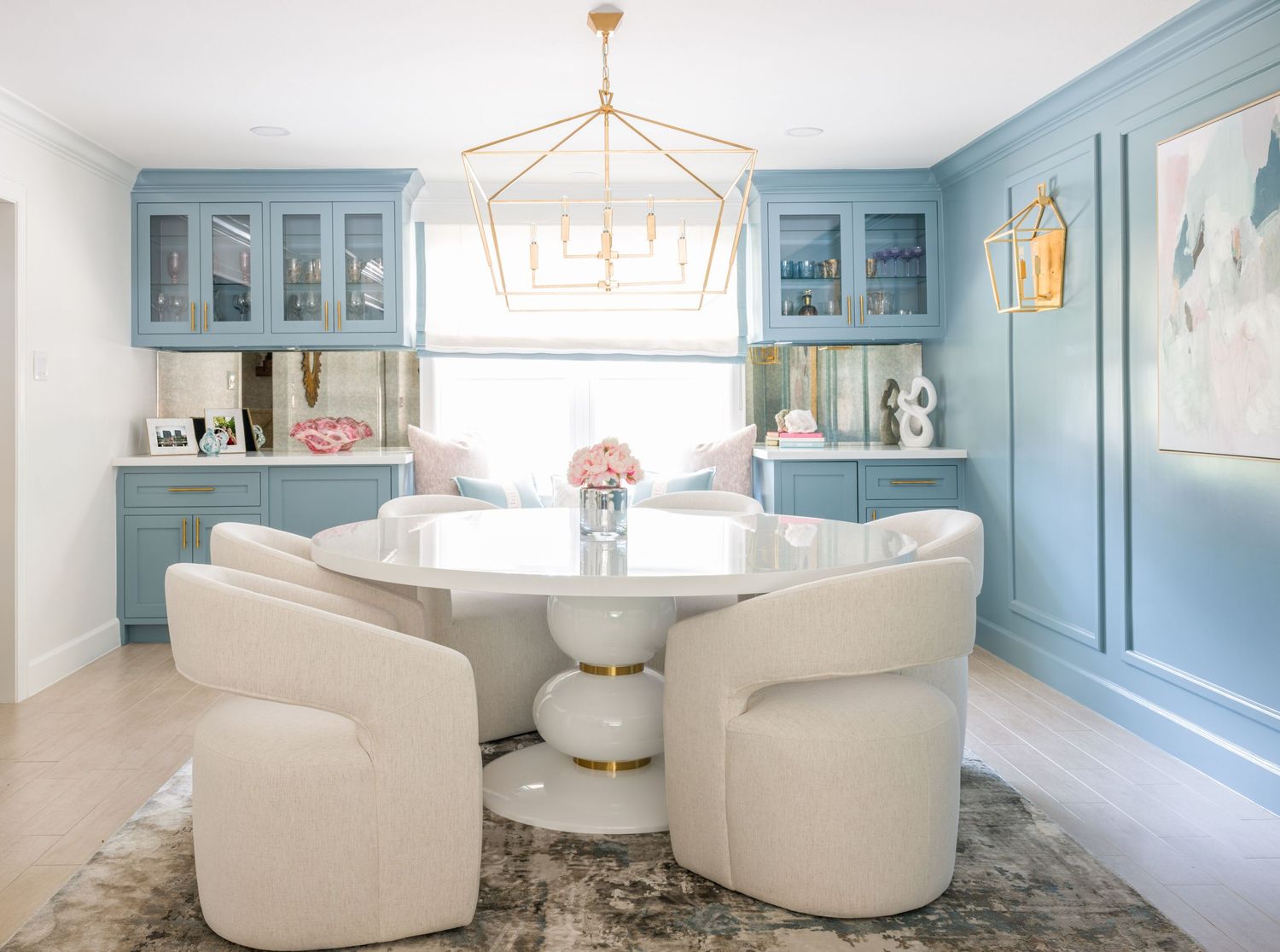 Collage of modern luxury living room interior design with light blue walls and white curved furniture pieces.