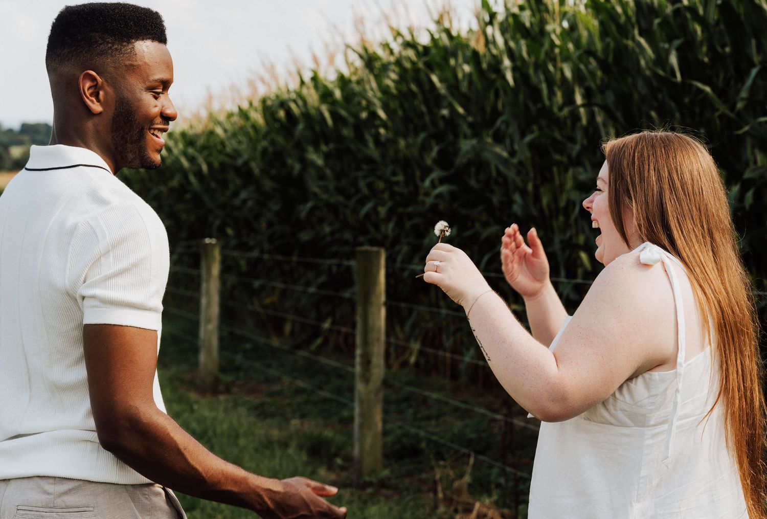 A couple reacting with joy and excitement during an Engagement Photoshoot at Waltz Vineyards Estate Winery in Manheim, PA