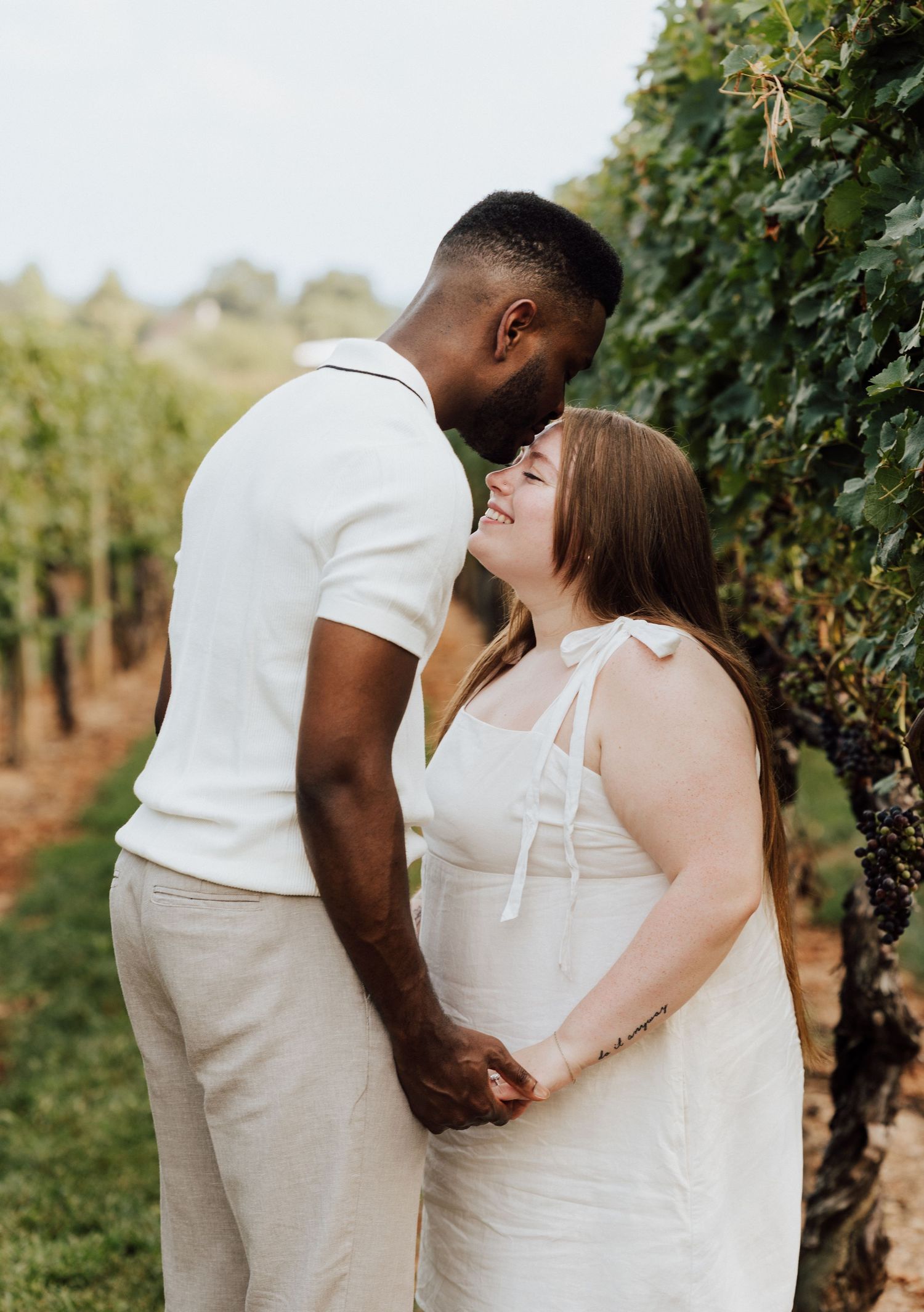 Couple kissing for Engagement Photoshoot at Waltz Vineyards Estate Winery in Manheim, PA