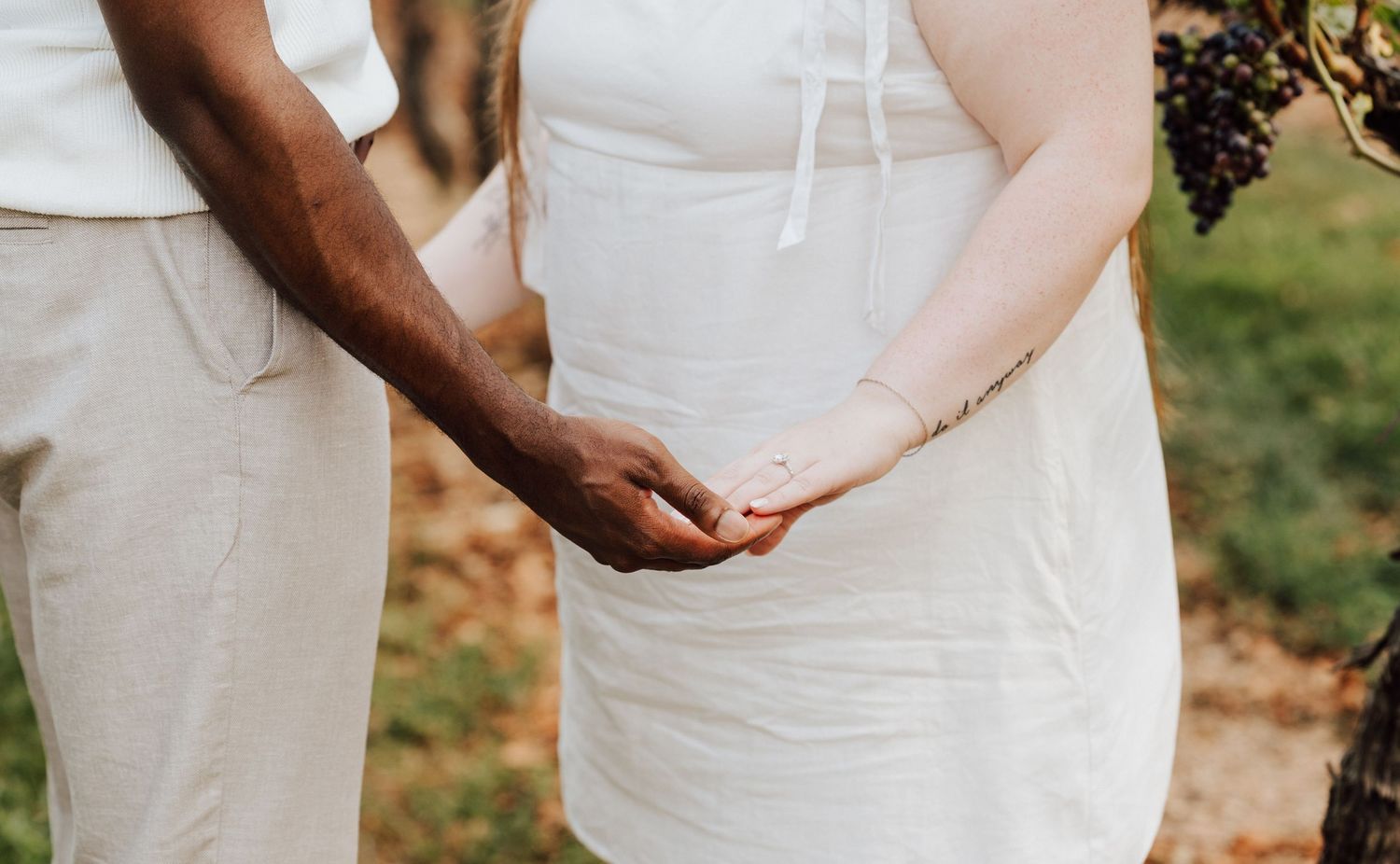 Couple holding hands embracing engagement ring for Engagement Photoshoot at Waltz Vineyards Estate Winery in Manheim, PA