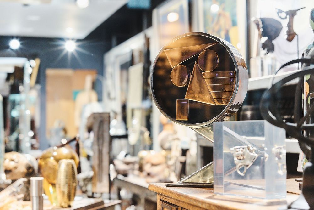 Stylish home decor items and accessories displayed in a retail store with warm lighting and modern design elements.