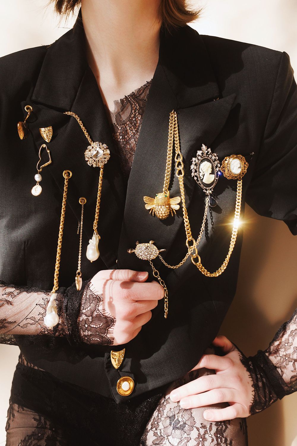 Vintage-inspired gold chain necklaces with pearl and cameo pendants displayed in multiple styling variations.