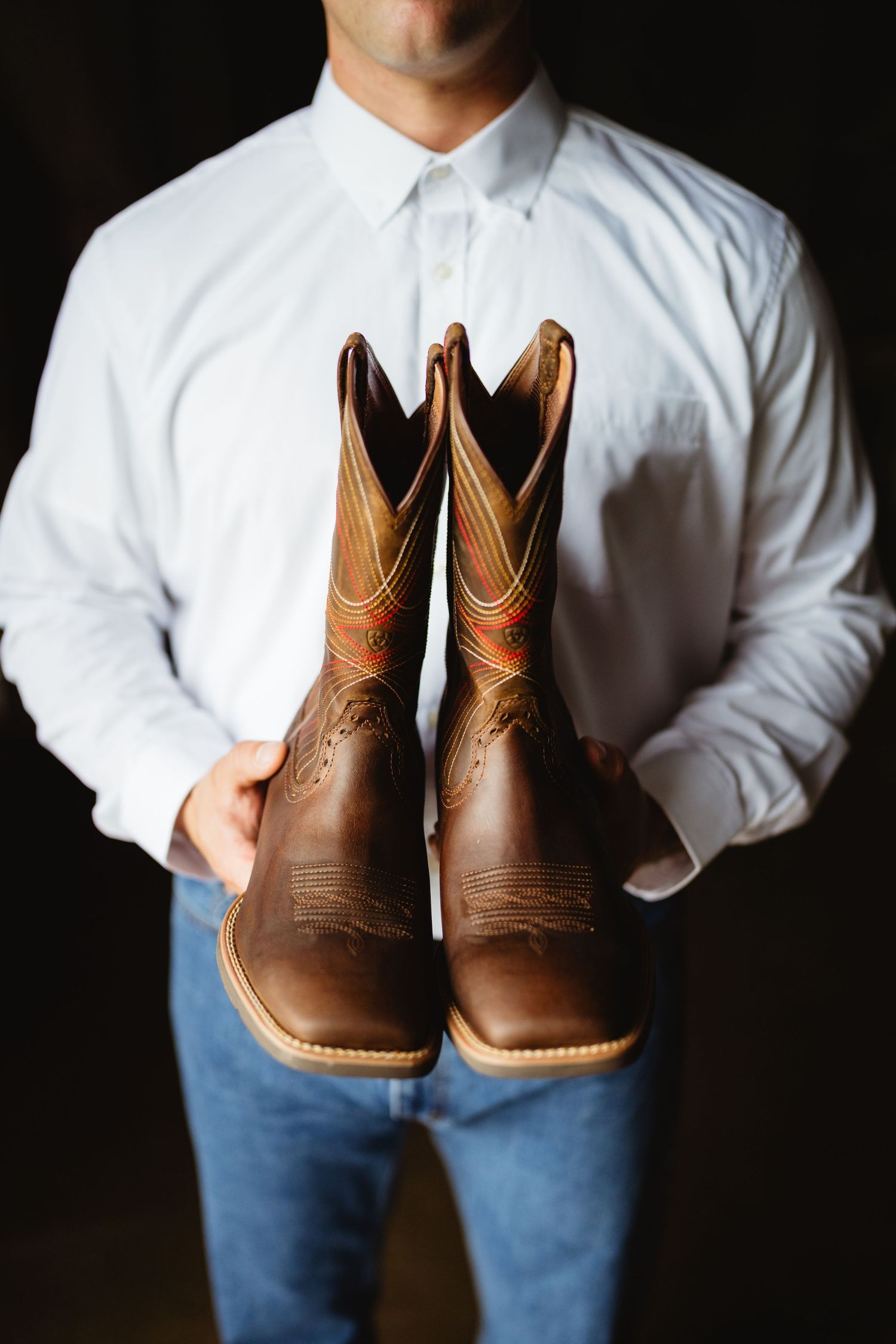 Multiple lifestyle photos showing someone in jeans and white shirt displaying brown leather western cowboy boots from different angles.