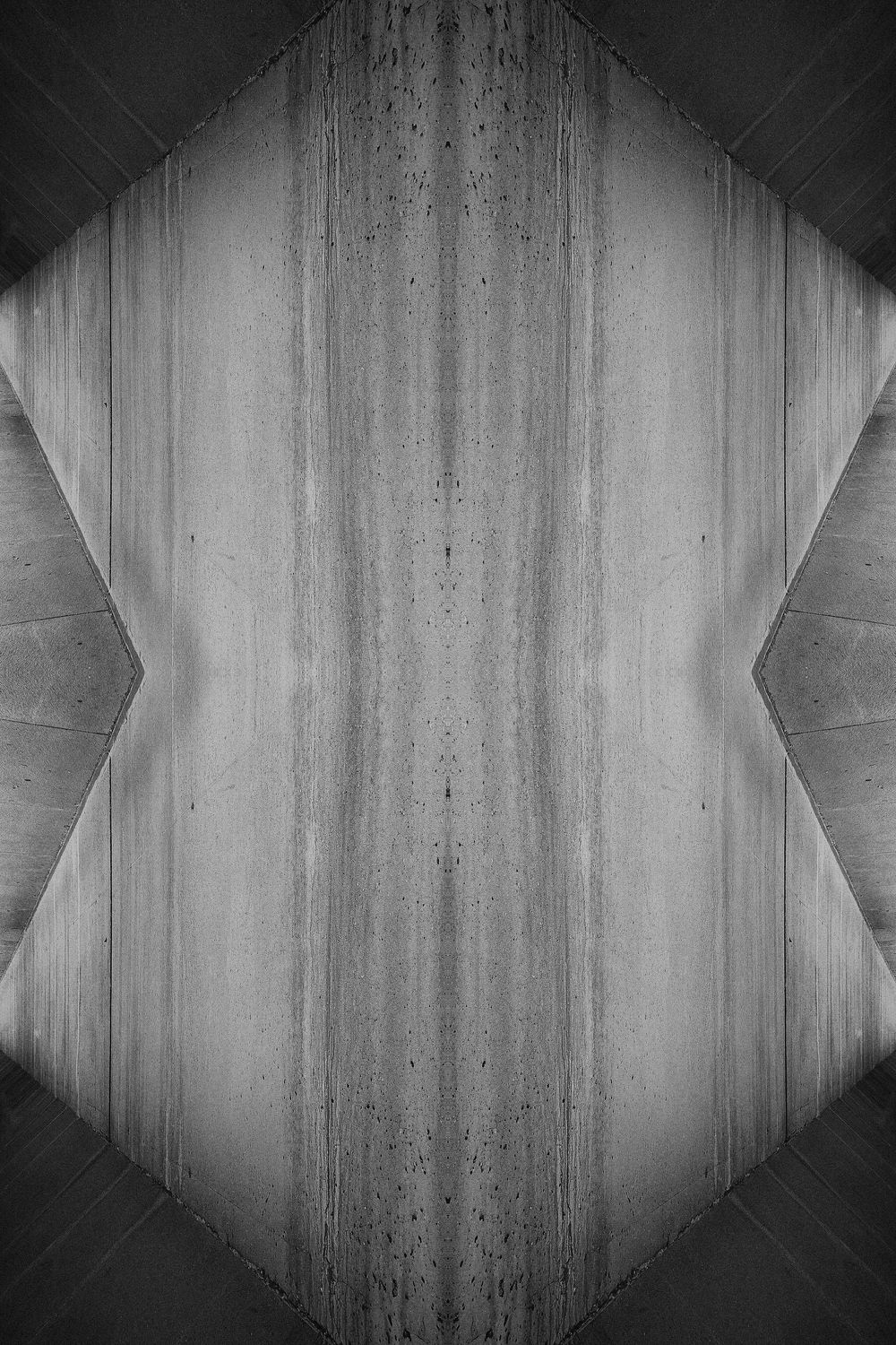 Abstract black and white architectural tunnel with geometric octagonal shapes creating a dramatic perspective effect.