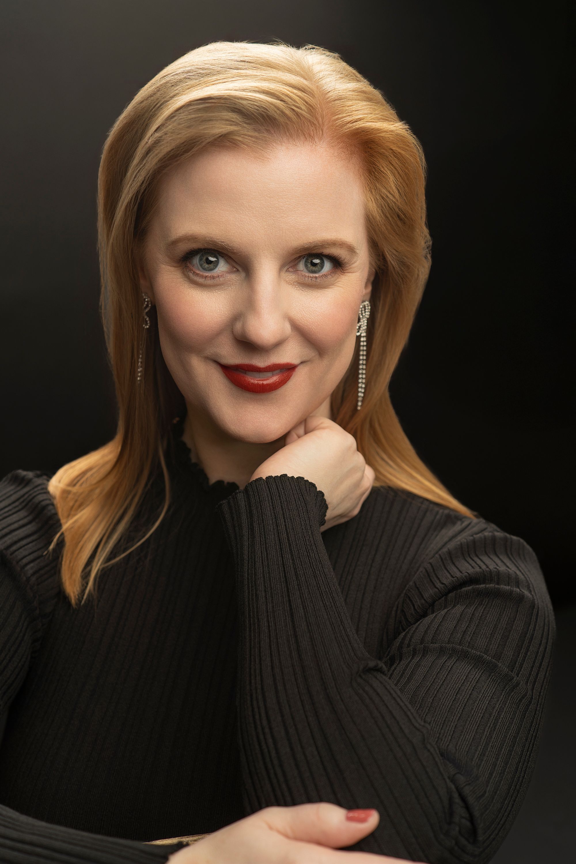 Portrait series showing a person in a black sweater with blonde hair posing against a dark background.