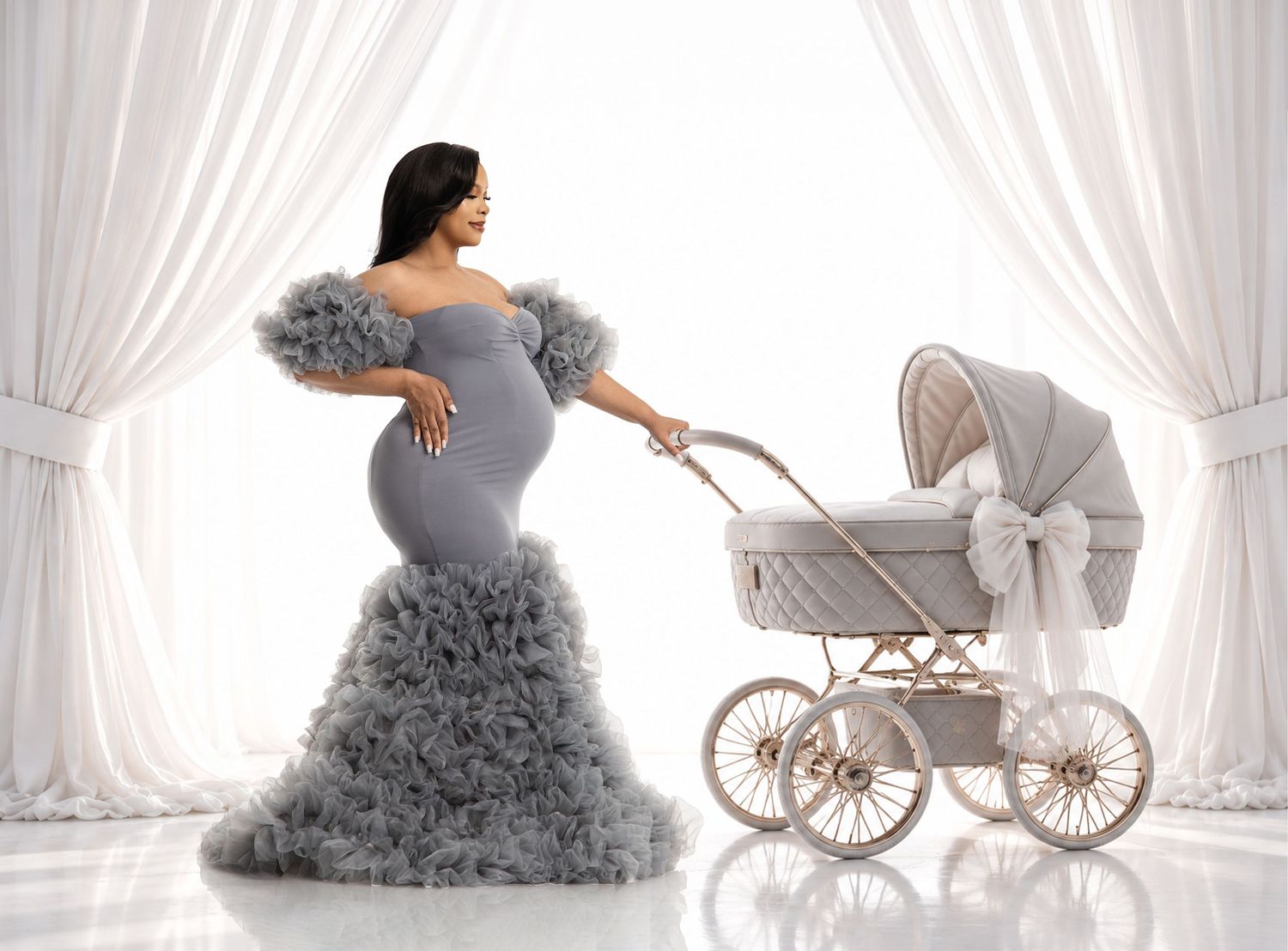 Expectant mother in a red ruffled gown beside a window-light pattern on a grey studio backdrop.