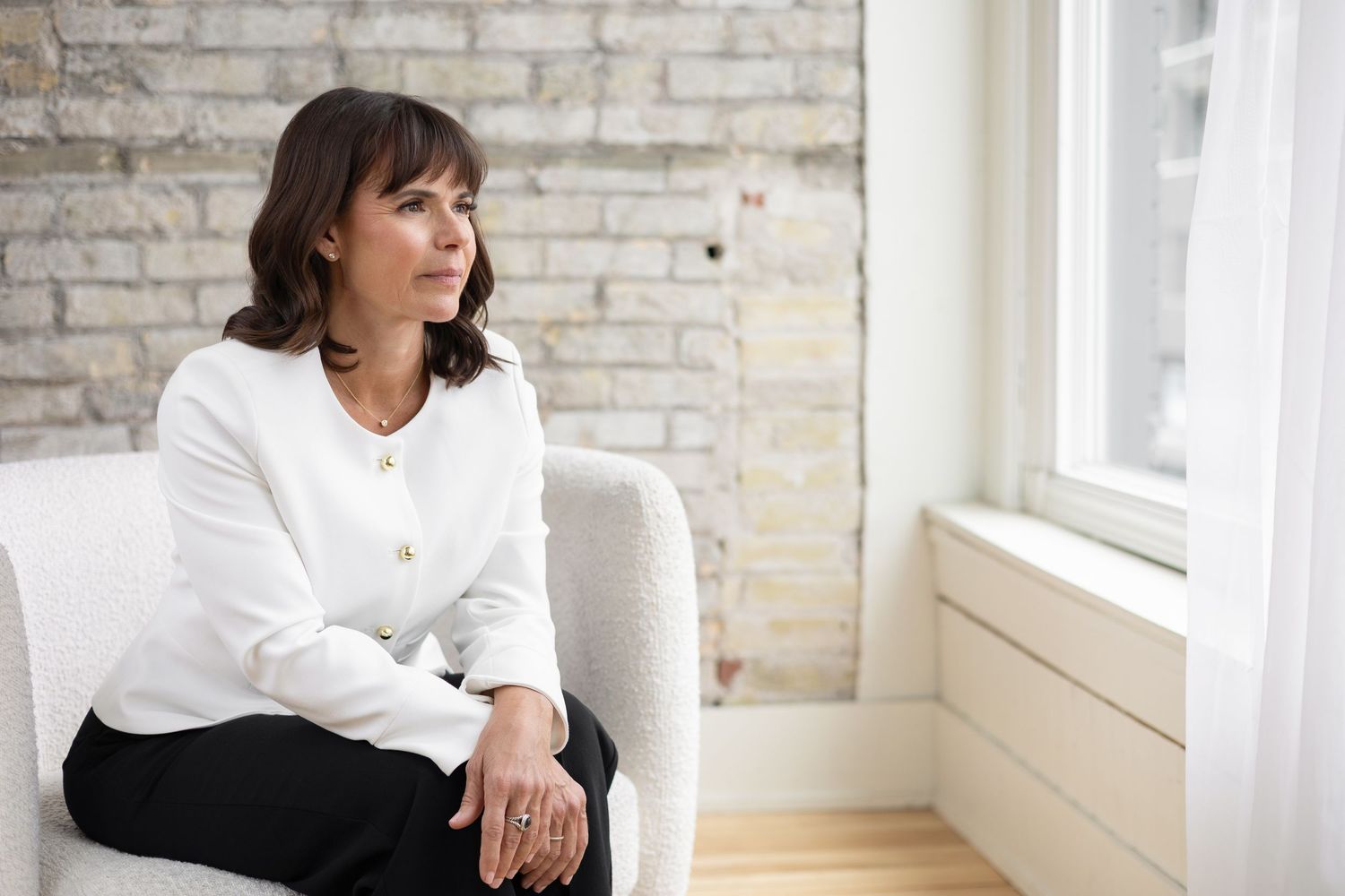 Personal branding client wearing simple, classic lines and white blazer during a lifestyle shoot in London, Ontario.