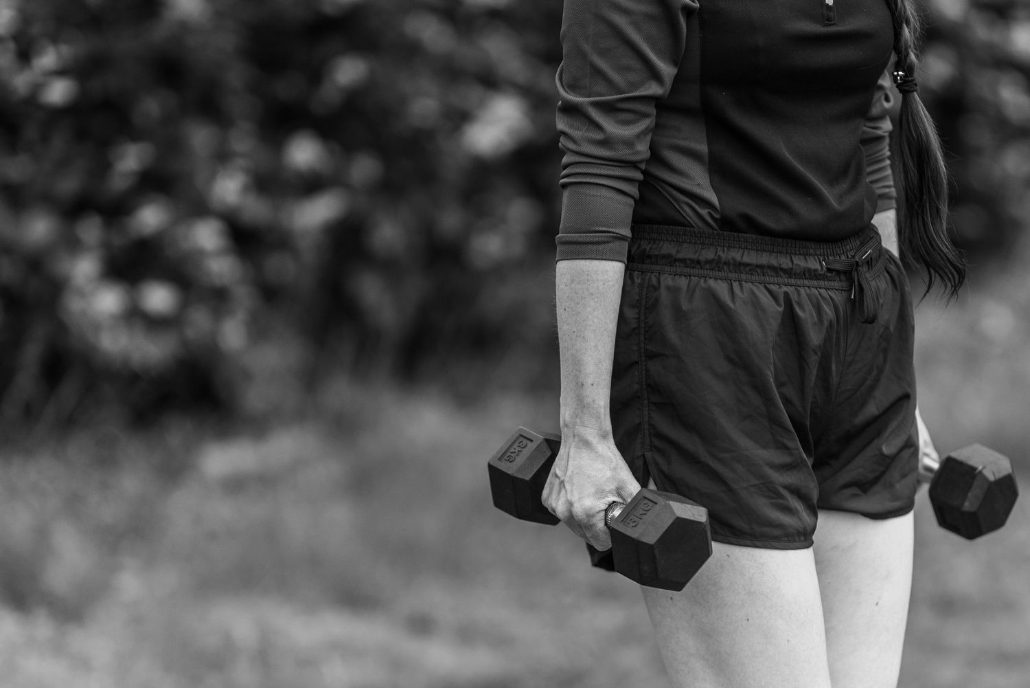 Collection of black and white photos showing workout gear and athletic clothing details.