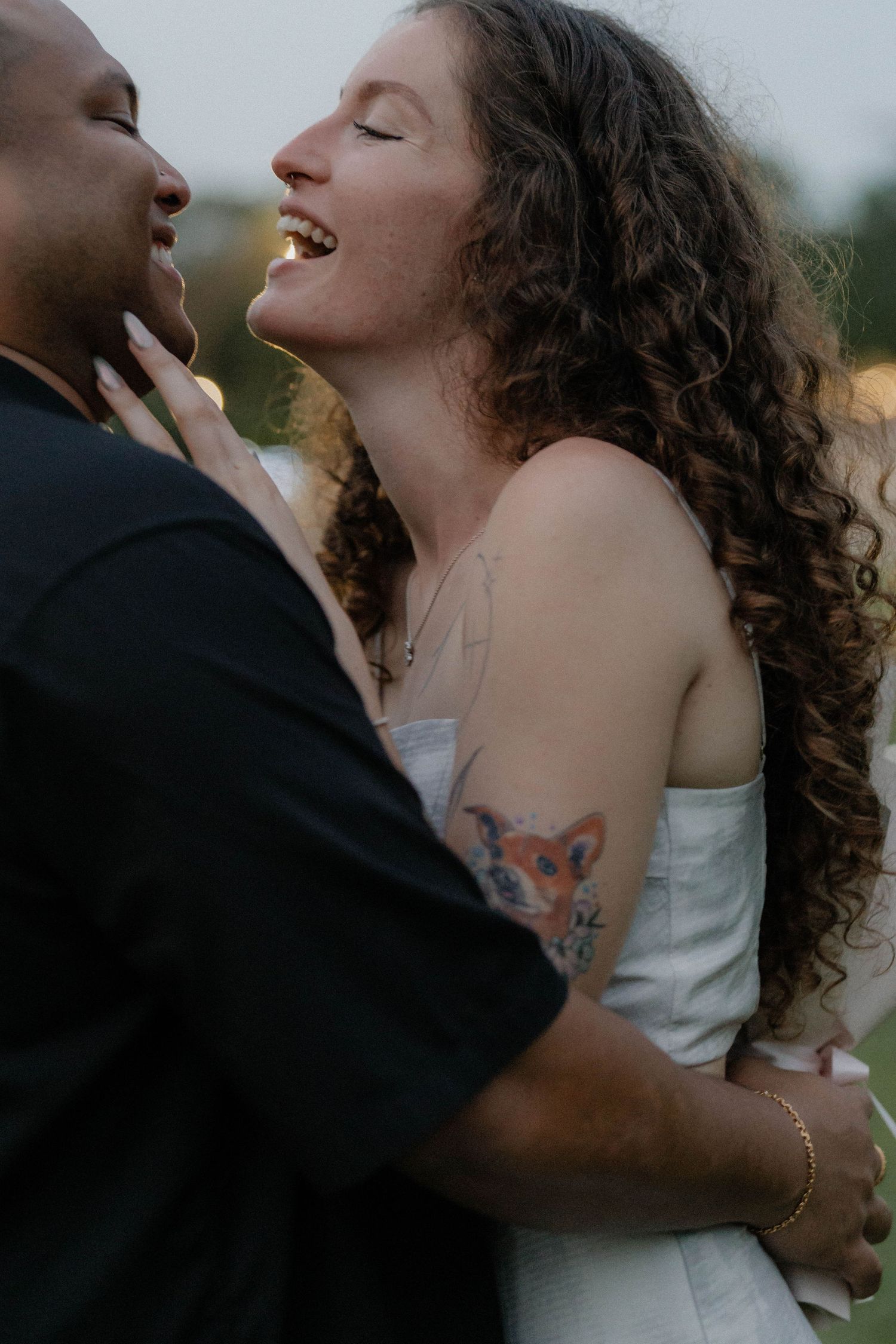 Intimate close-up of a couple sharing a passionate embrace outdoors.