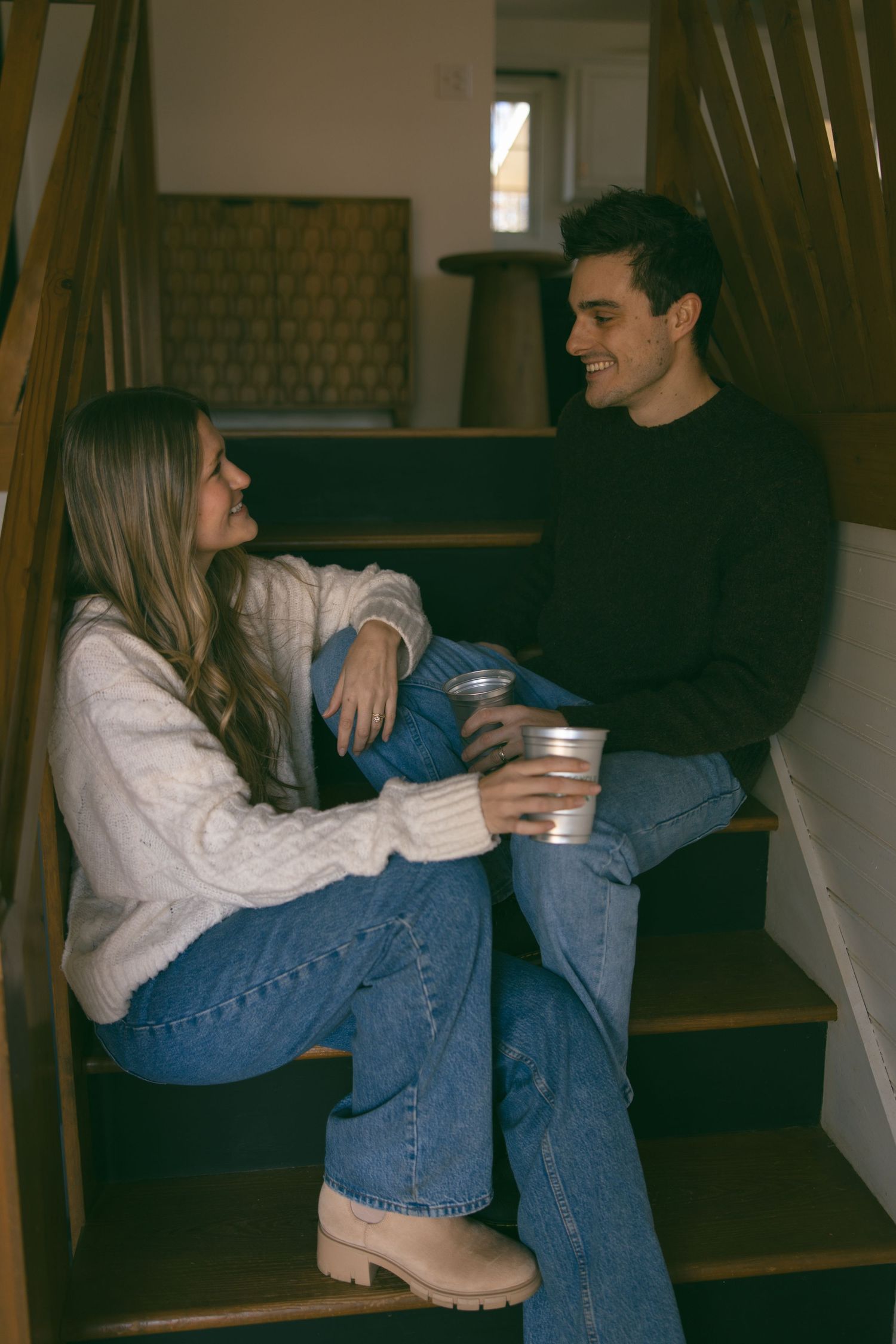 new home asheville photoshoot couples empty house lifestyle session stairs drinking