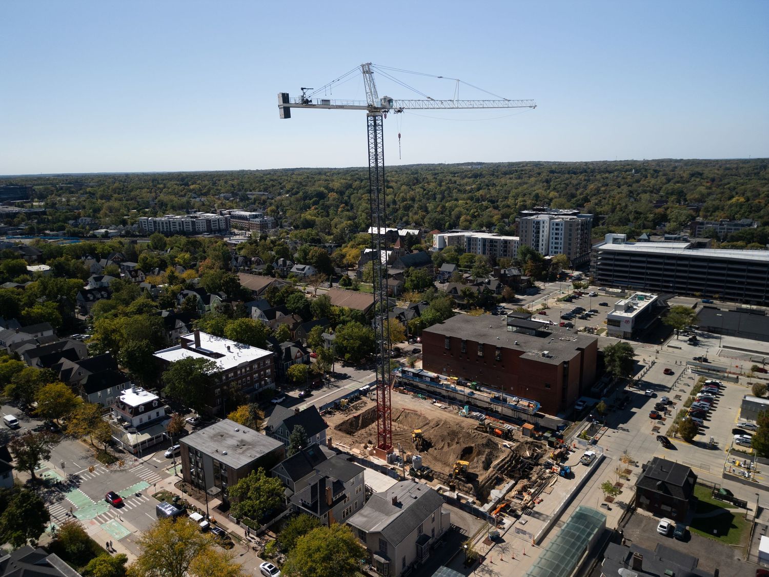 Aerial drone image of Ann Arbor construction site showing site layout, machinery, and build progress by Aerial Detroit.