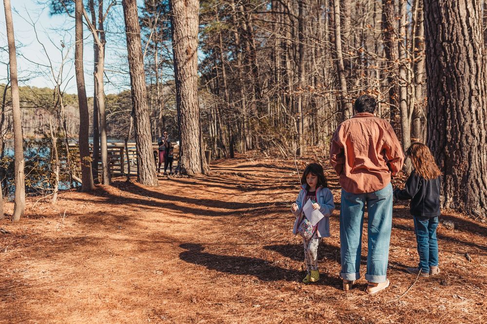 A woman and children play in the winter woods of Virginia. Whitney Popp, Arizona photographer