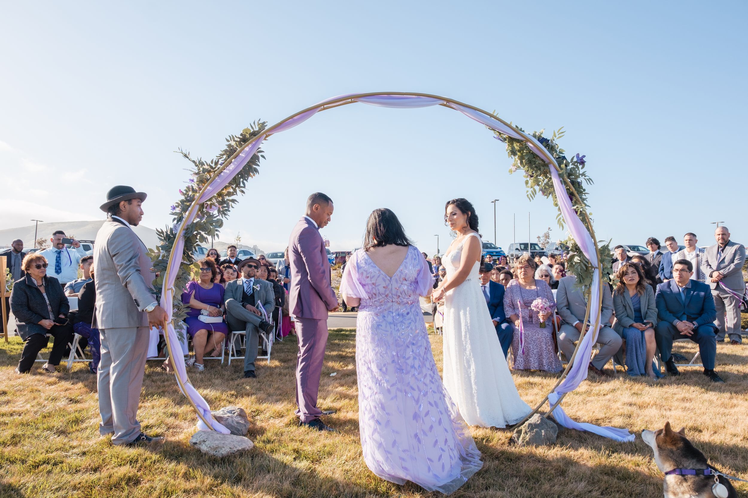 Couple getting married during a lilac themed wedding.