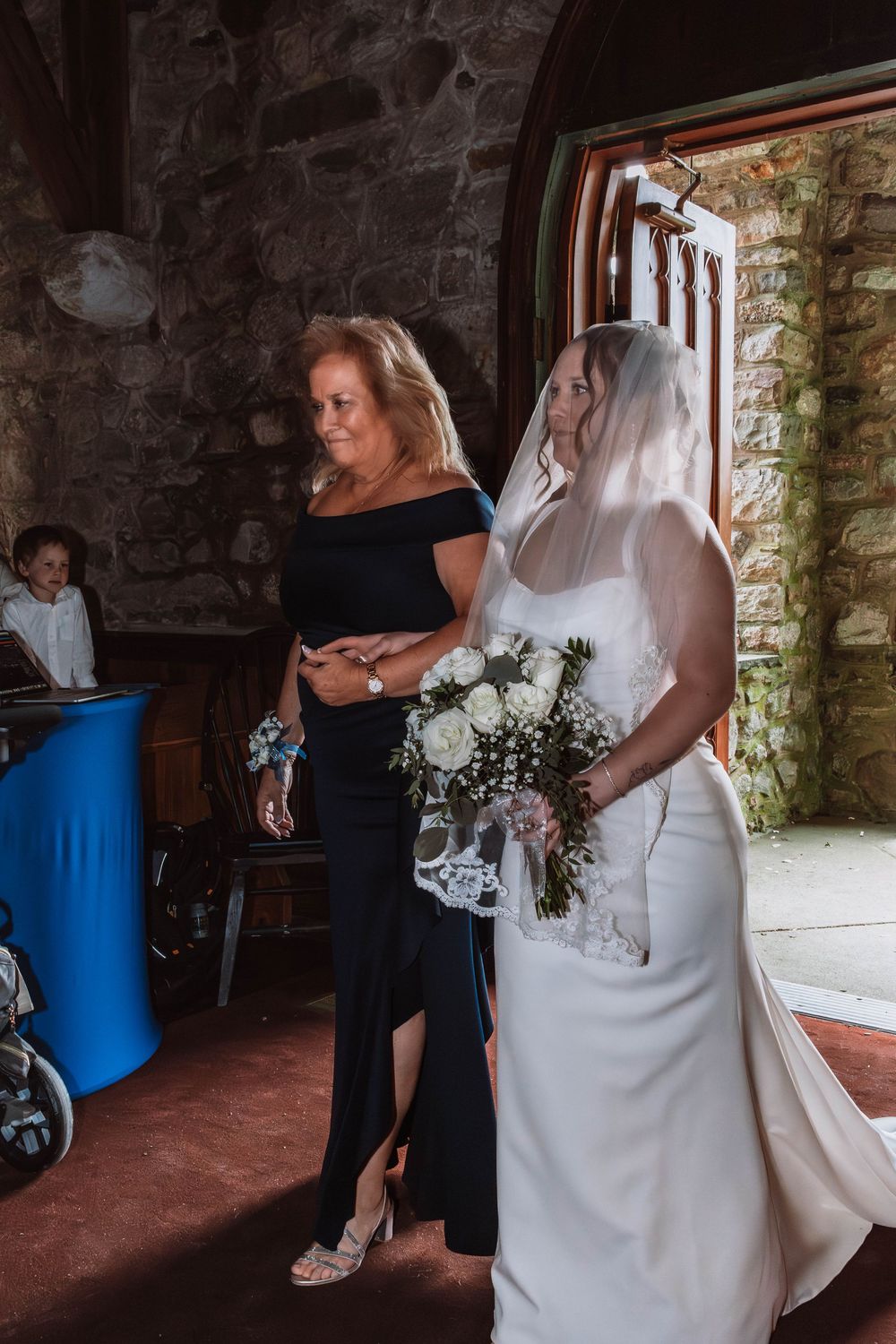 Bride walking down aisle at Cragsmoor stone church wedding ceremony in Hudson Valley NY