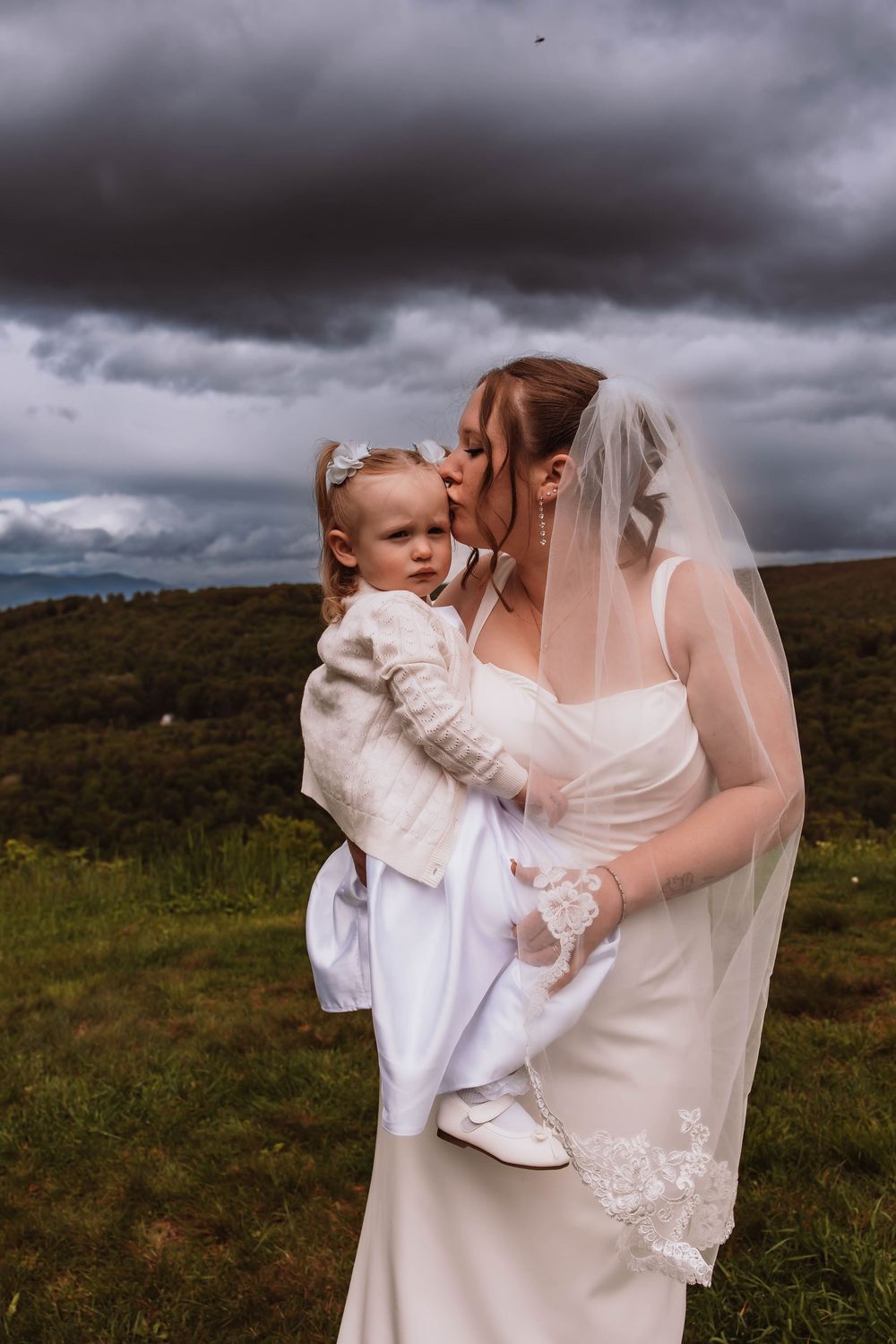 Bride and daughter with mountain views at cragsmoor stone church hudson valley NY