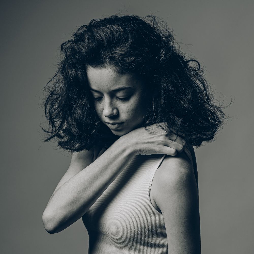 A dramatic black and white sequence showing emotional movement and expressions in monochromatic tones.