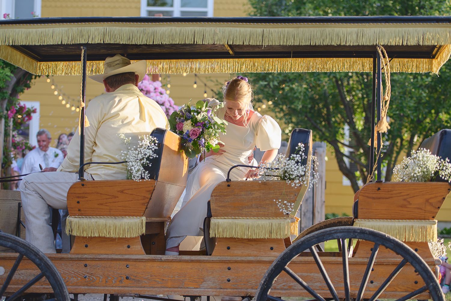 Blackfoot wedding photographer ShutterGirl send off with horse and carriage at backyard wedding in Blackfoot idaho