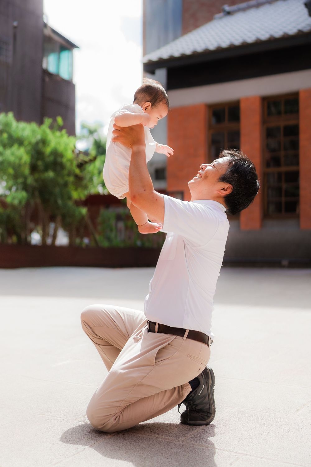 A sequence of photos showing someone in white clothing falling backwards onto the ground in a dramatic motion.