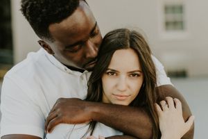 Intimate couples portrait series shot in muted tones against neutral background.