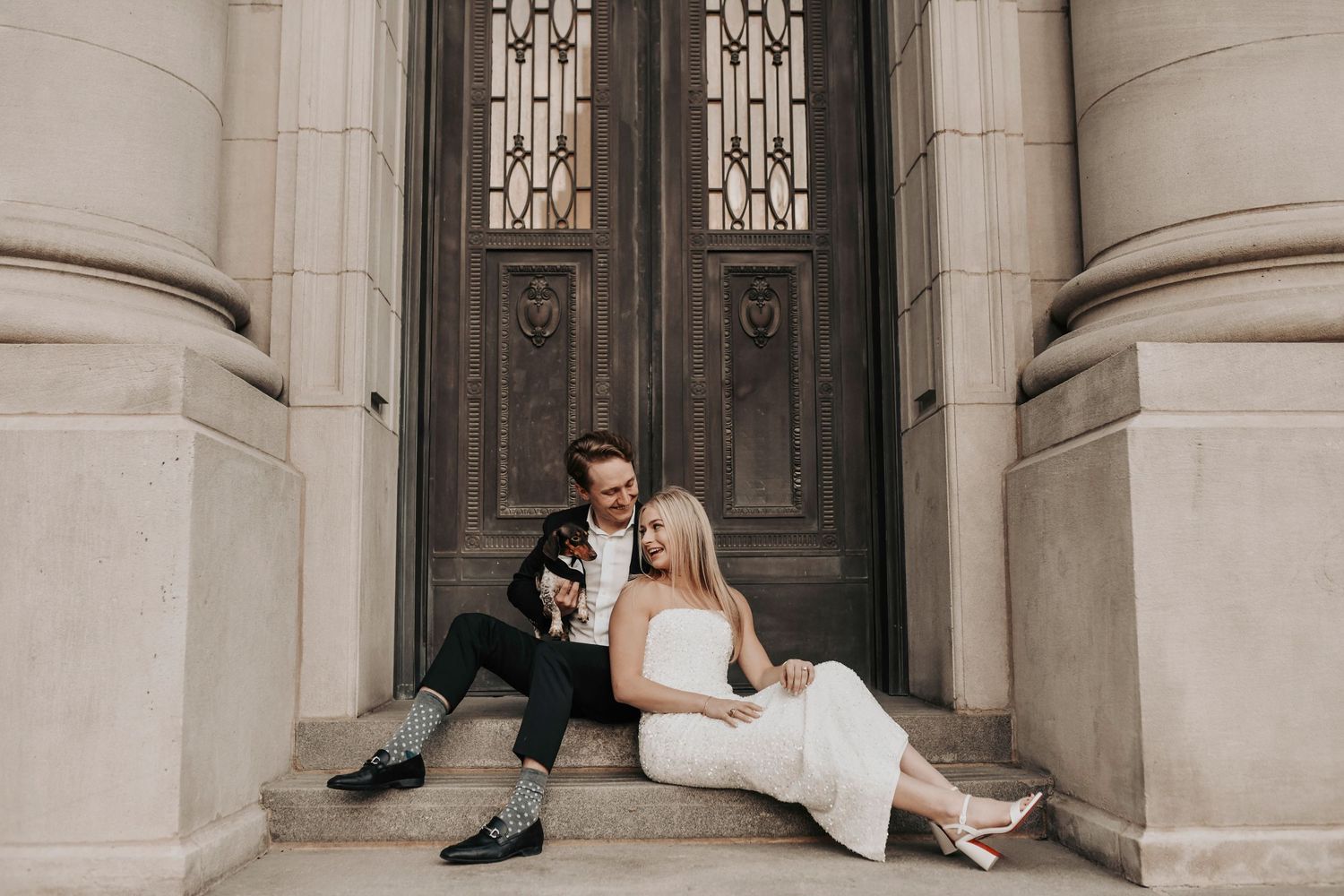Storytelling engagement photos of couple and dog in Dallas arts district