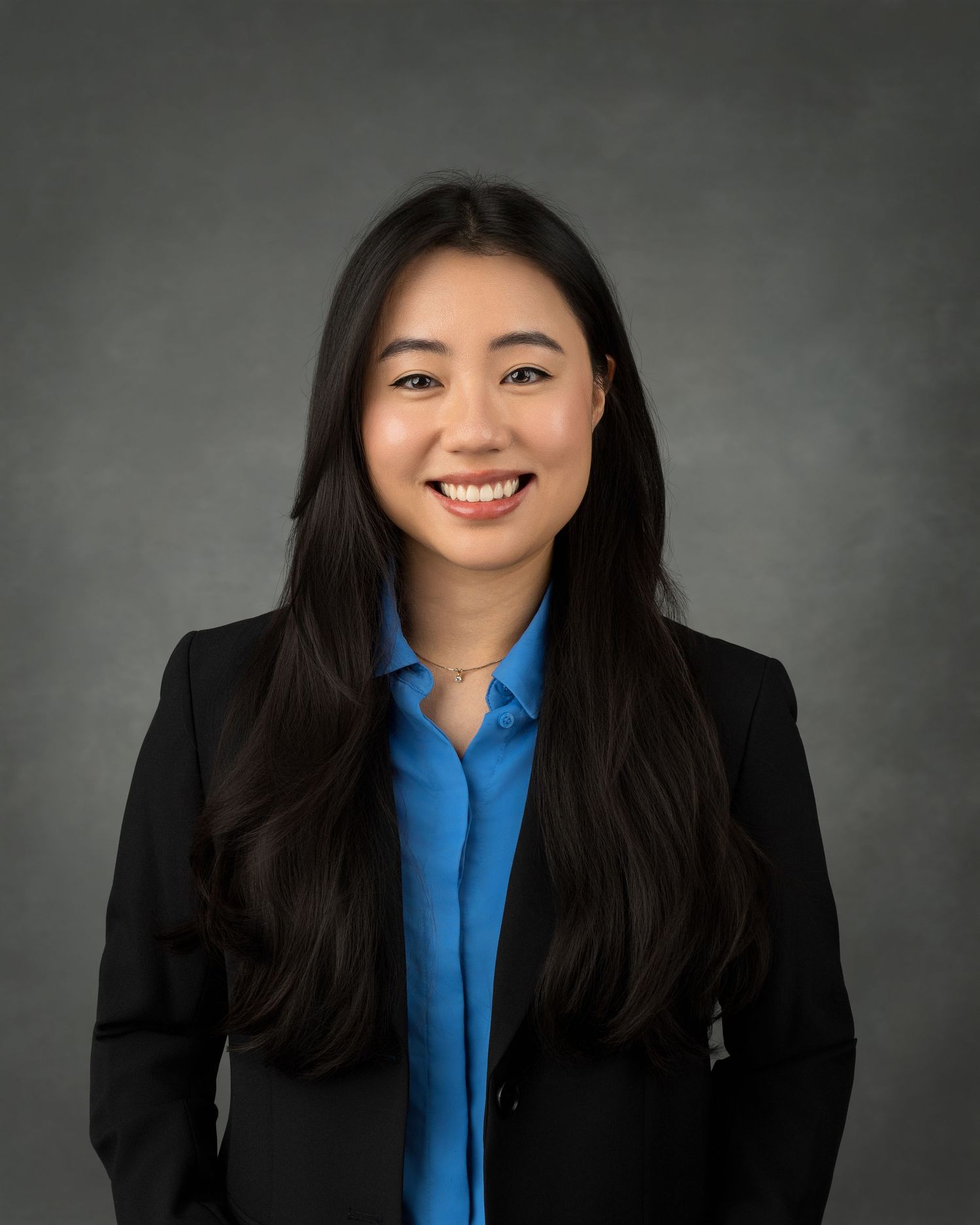 Professional portrait series of a person in a white blazer against a dark brown background showing different poses.