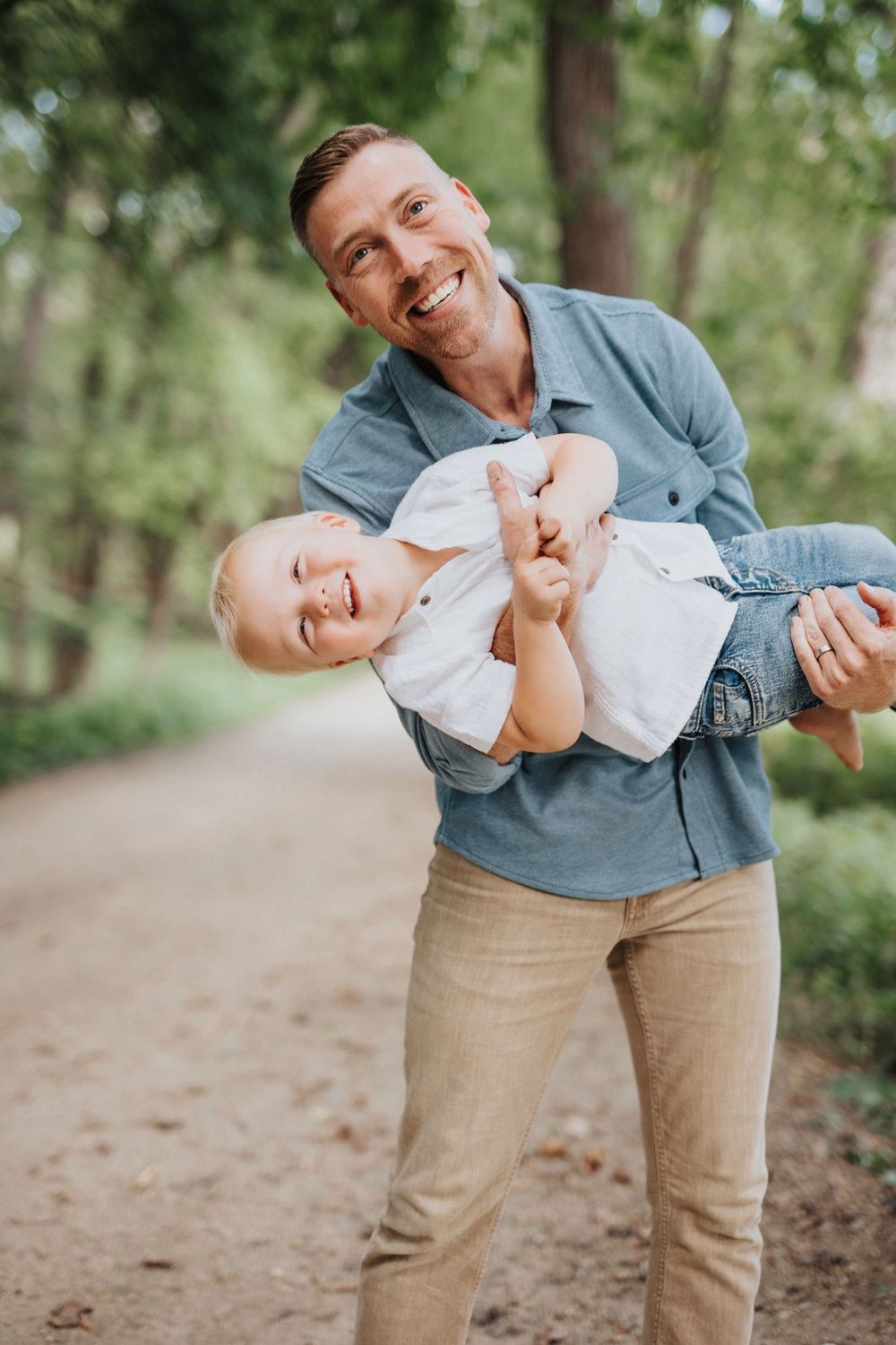 Candid family photos showing affectionate interactions in a natural forest setting.