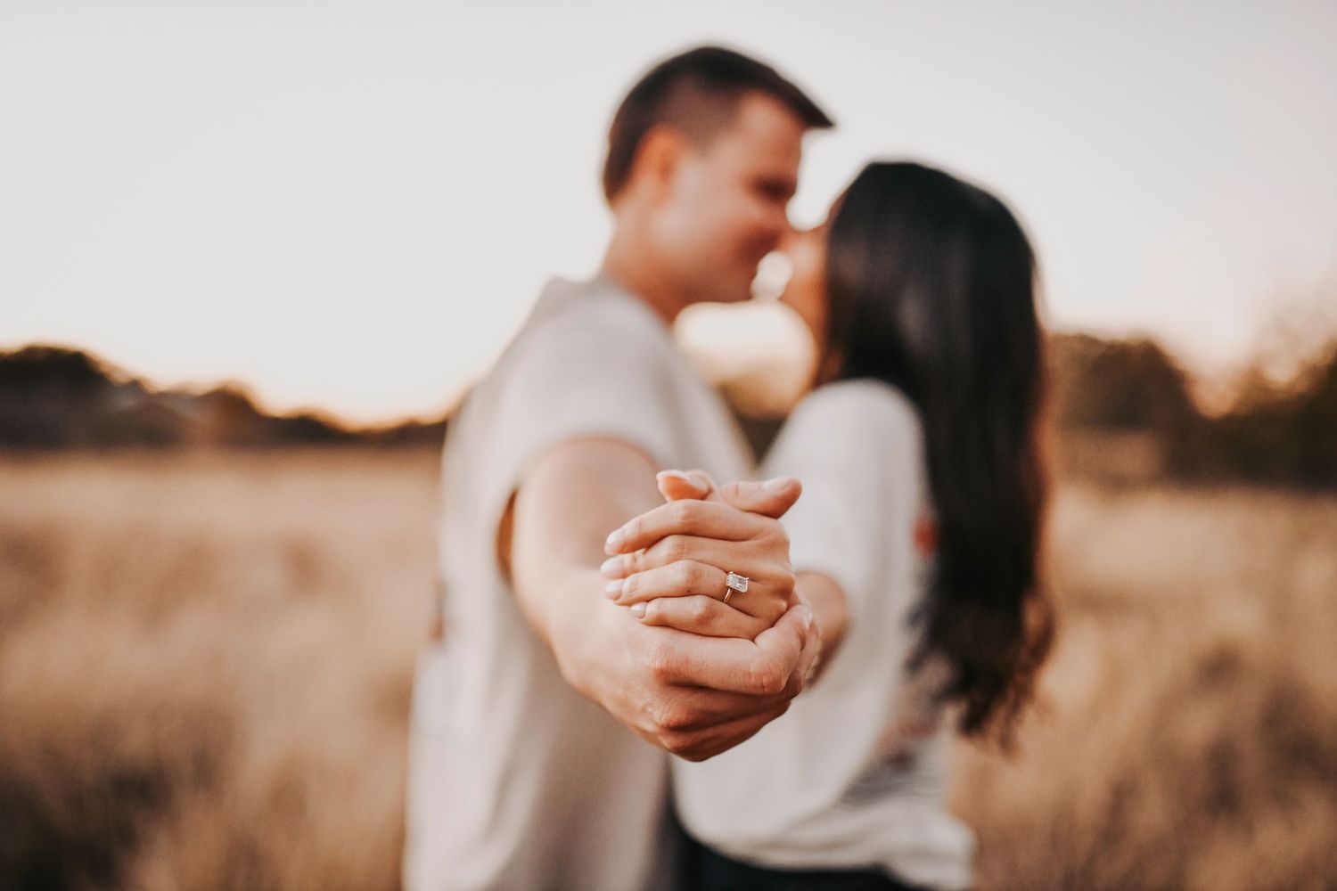 DFW engagement photos featuring a detailed close-up of a diamond engagement ring