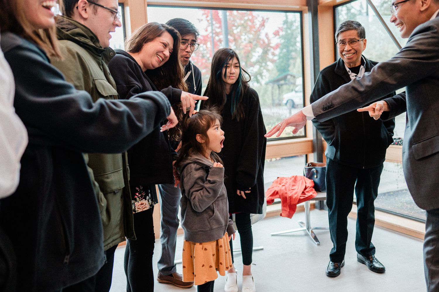 groom shows off new wedding band to little girl in shock and awe