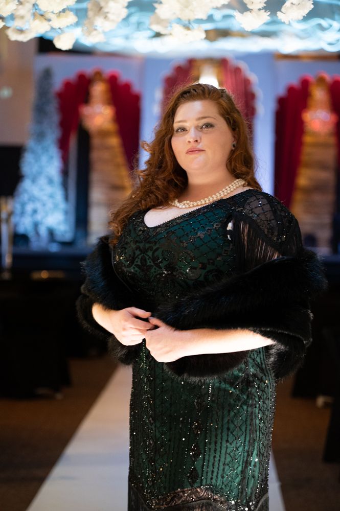 Dramatic evening photography of a black sequined formal gown.