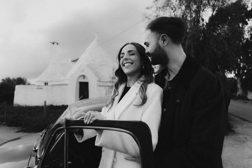 A series of black and white candid wedding photographs showing joyful moments and laughter during a celebration.