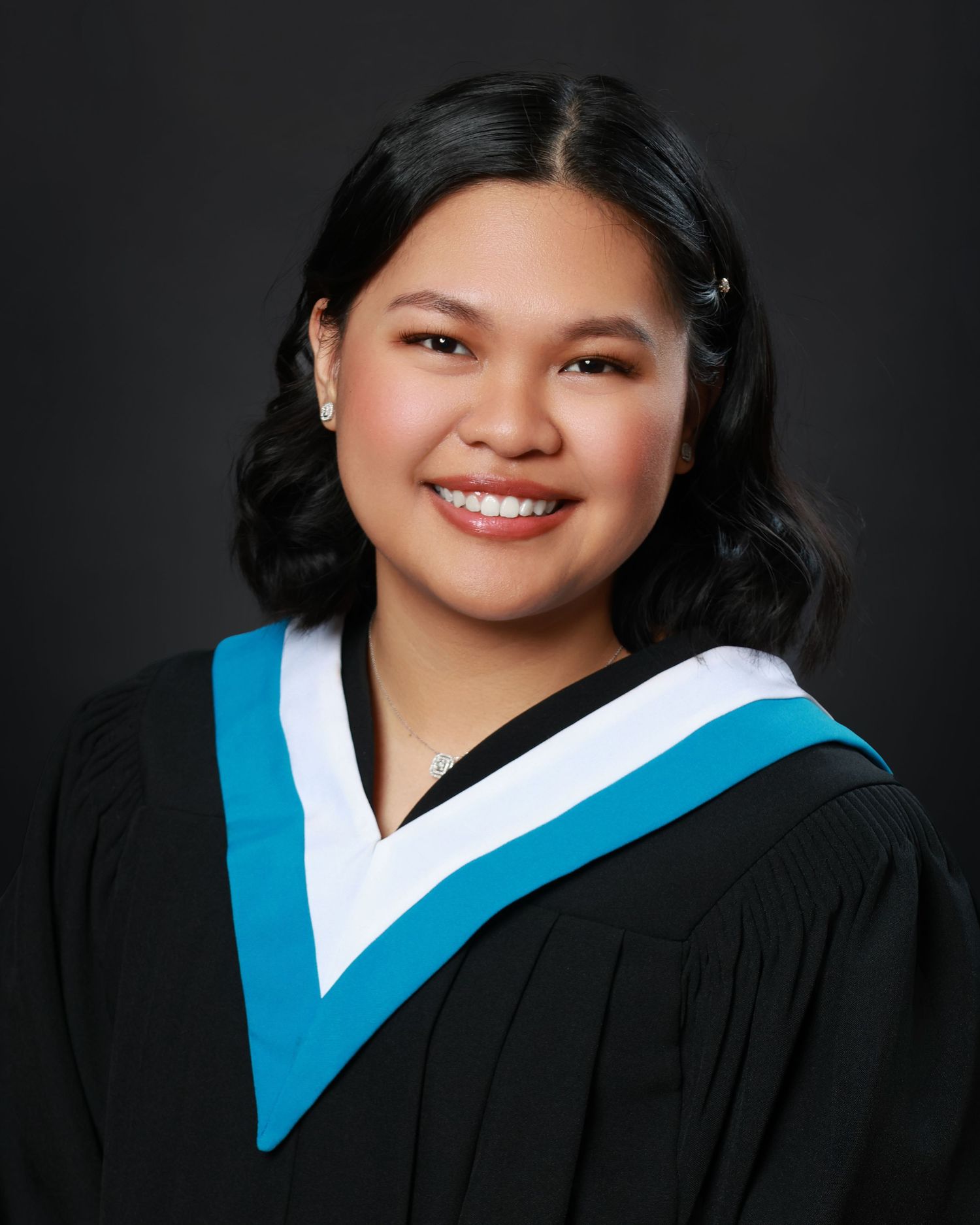 Senior Grad photo with traditional pose and clean backdrop