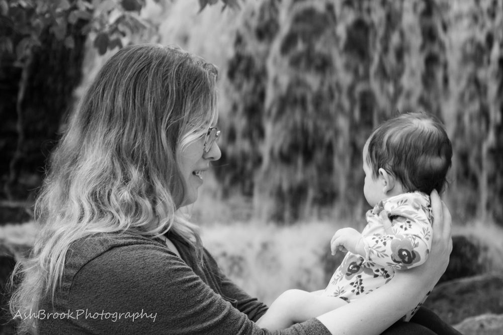 Picture of mother & baby in front of waterfall
