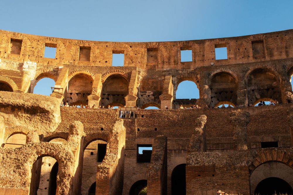 Inside the Colosseum at golden hour.