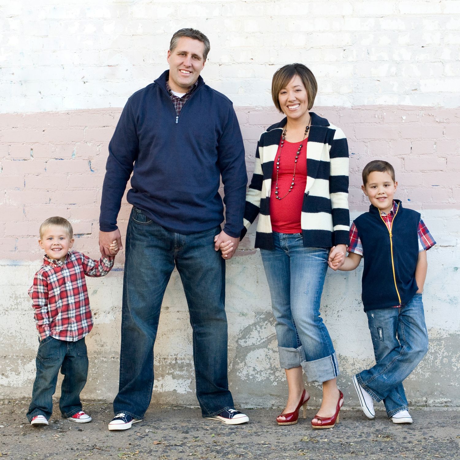 Smiling Family with brick background in Urban Tucson