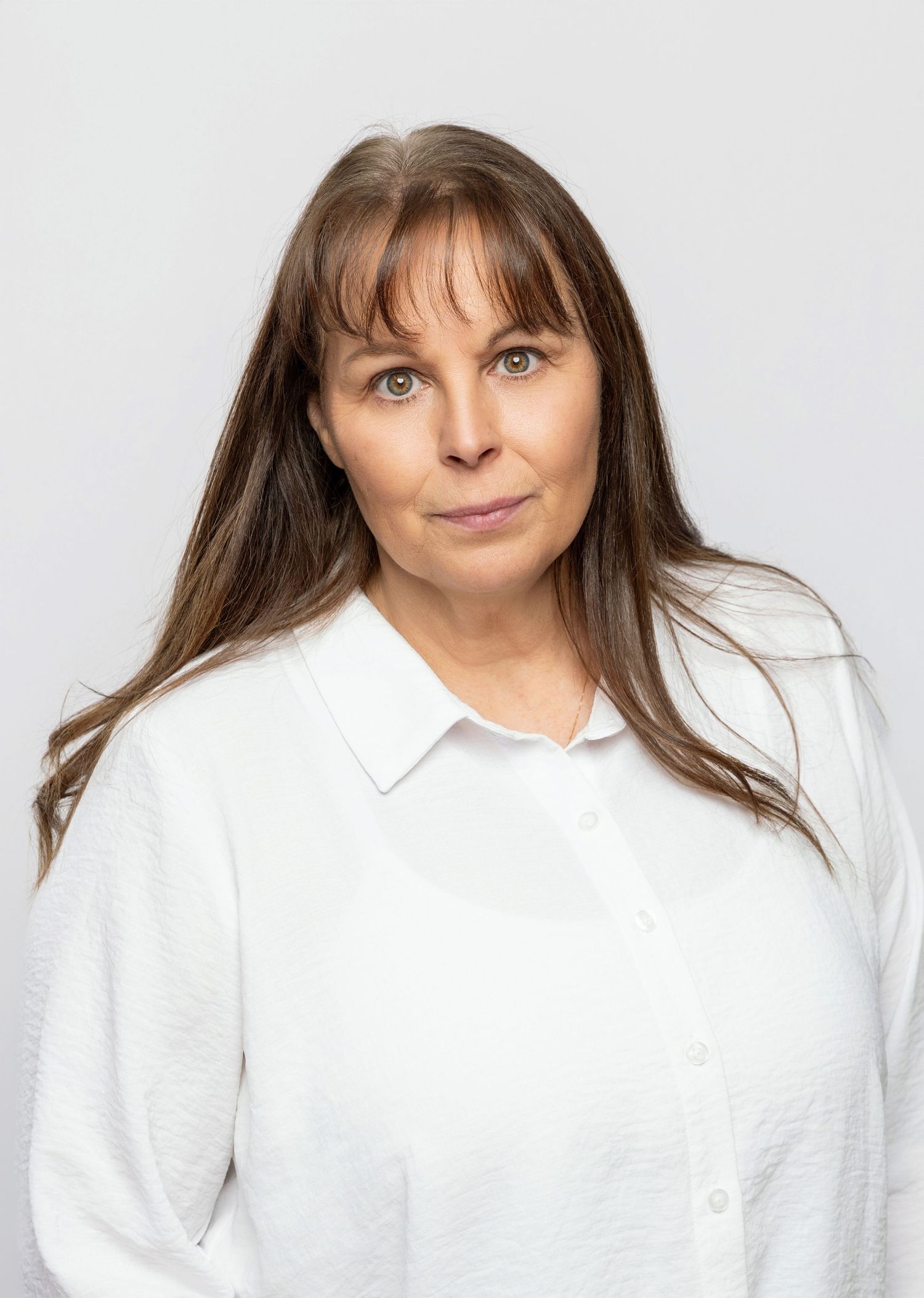 Studio headshots against white background showing various expressions.