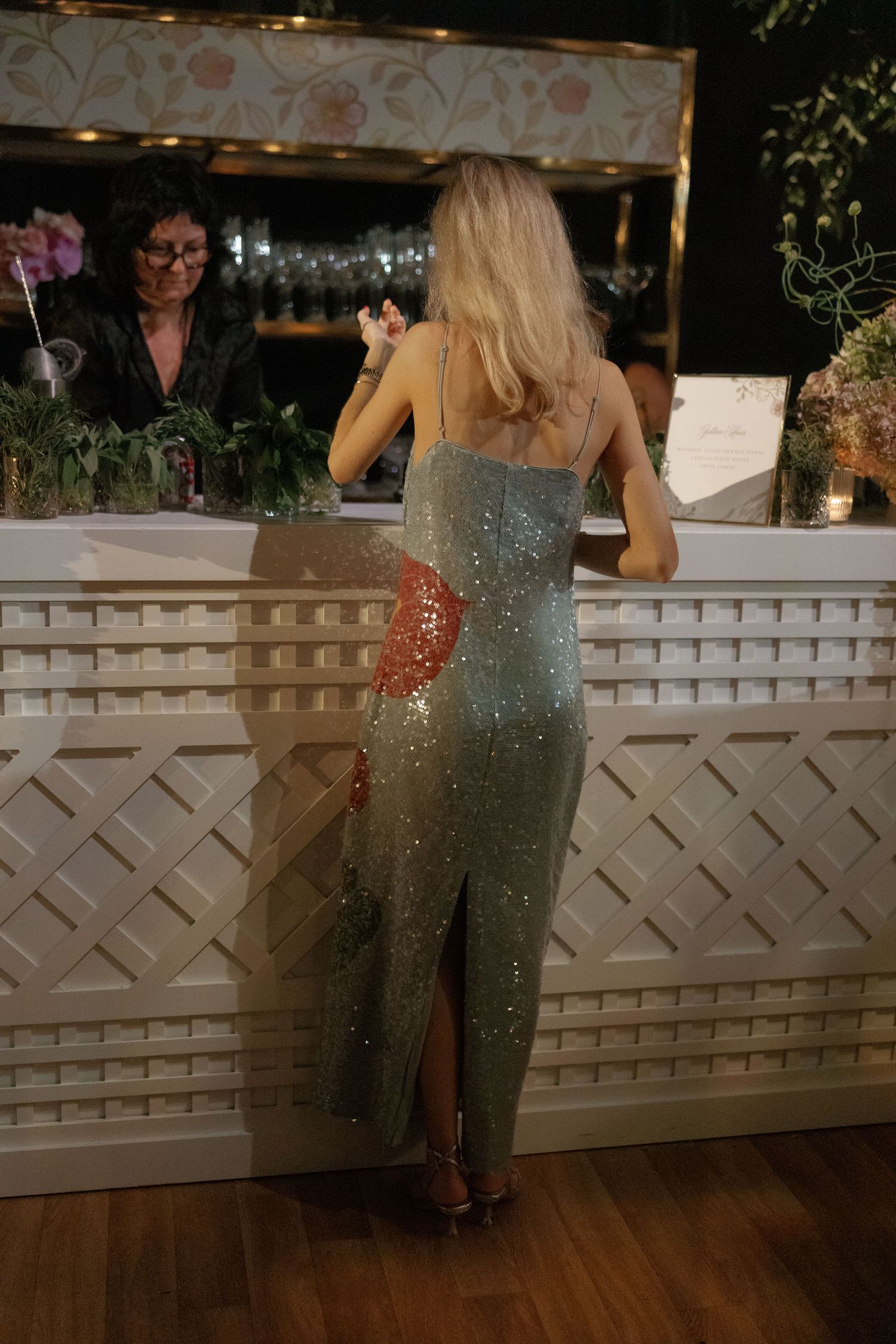 A series of images showing a person in a sparkly green evening gown leaning against a white lattice railing at a formal event.