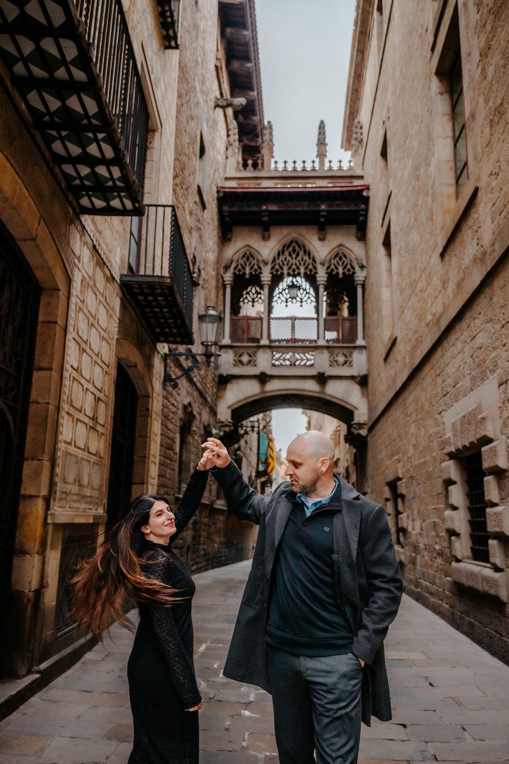 A playful kiss as they stroll through the Old City’s romantic streets