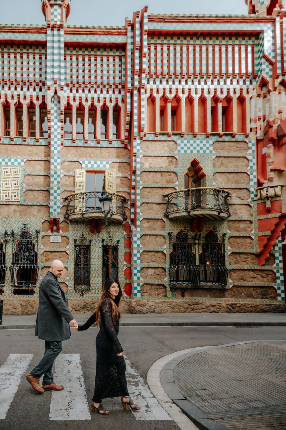 Kim twirling with joy in front of Gaudí’s vibrant patterns