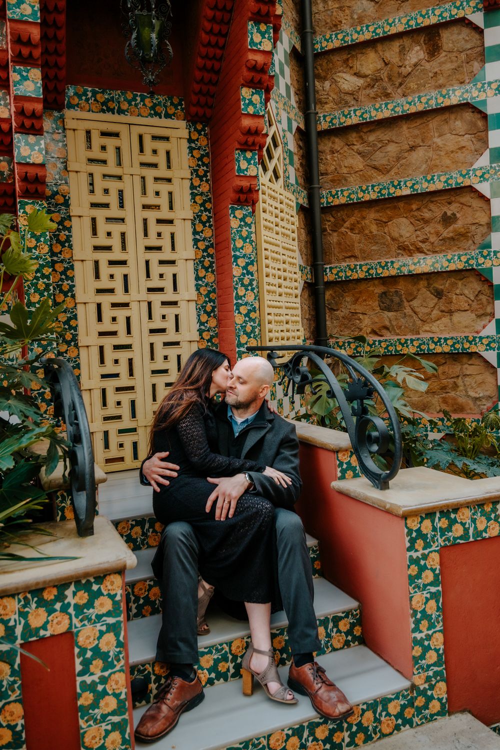 Laughing together inside a richly patterned room at Casa Vicens