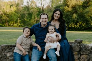 Family group photo session in a scenic park during golden hour.