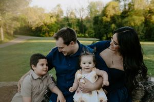 Casual family portrait series captured in an outdoor natural setting.