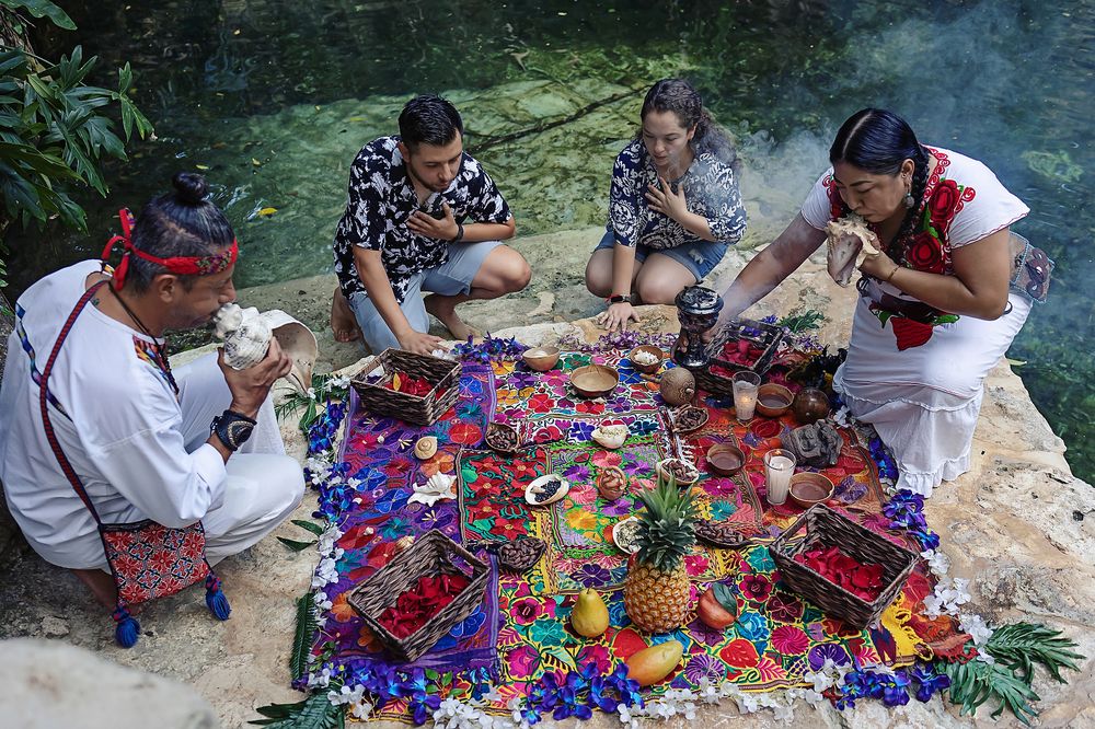 Colorful altar with natural offerings during the spiritual Mayan ceremony at Kantun Chi cenote