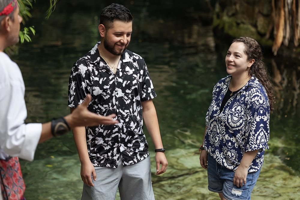 Osvaldo and Paulina smile during their spiritual Mayan proposal at a cenote in Ecopark Kantun Chi