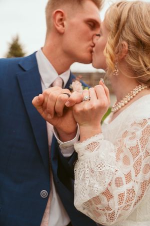 A romantic close-up series showing tender kisses and embraces between a couple in wedding attire.
