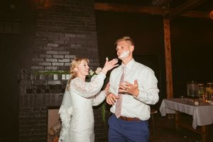A couple shares a joyful moment together while dancing at their wedding reception.