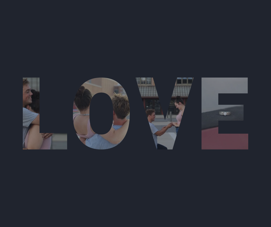 Large brushed metallic letters spelling LOVE stand against a textured dark background.