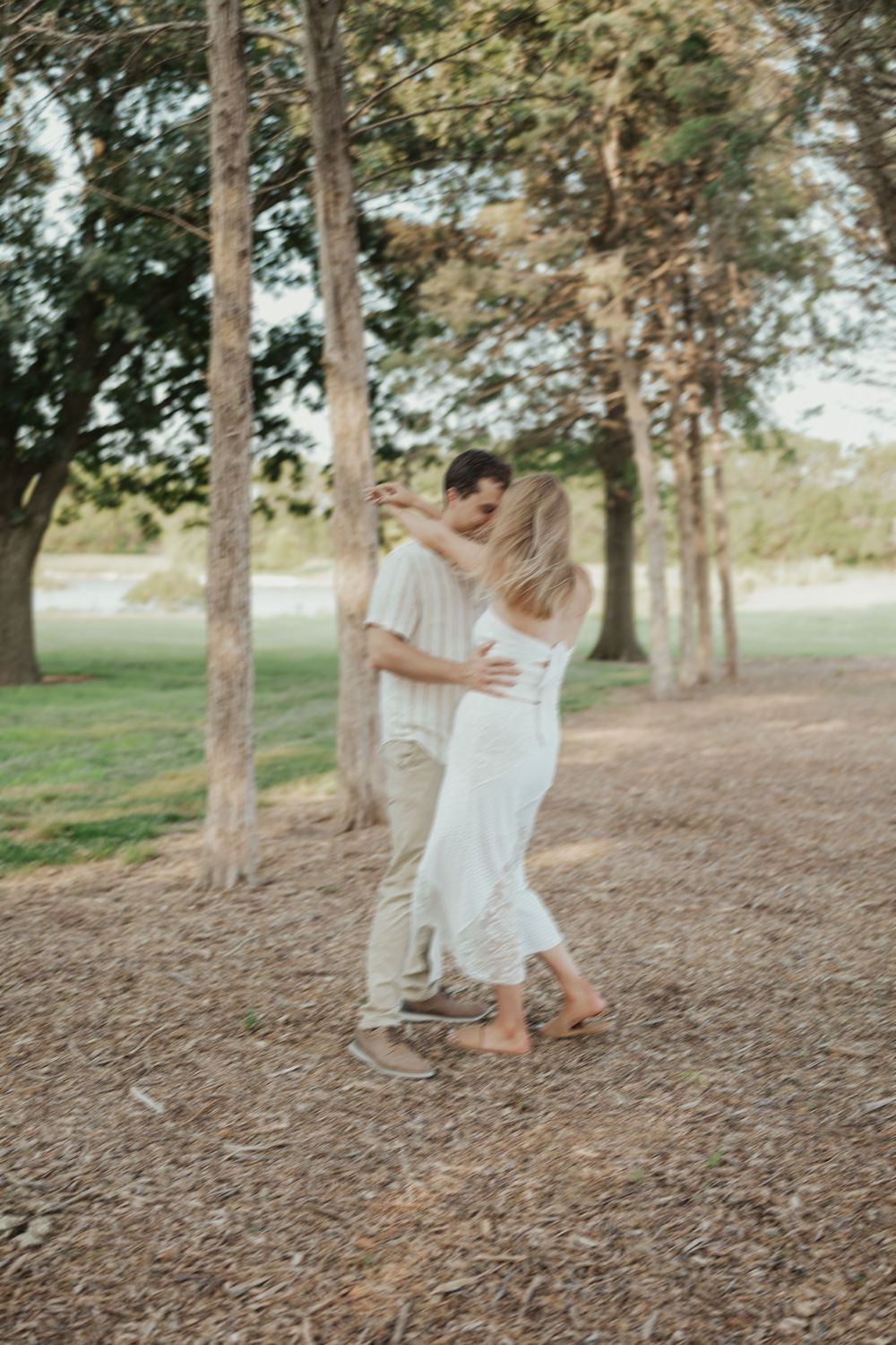 Candid forest couples session with dancing under the trees in Kansas