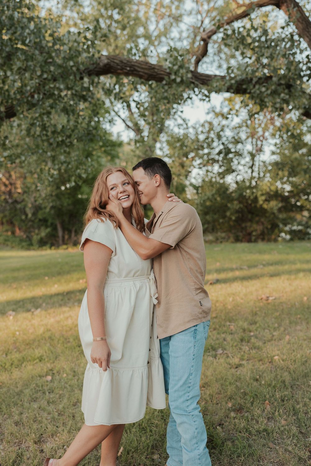 Joyful candid couples photo in sun-drenched Wichita park