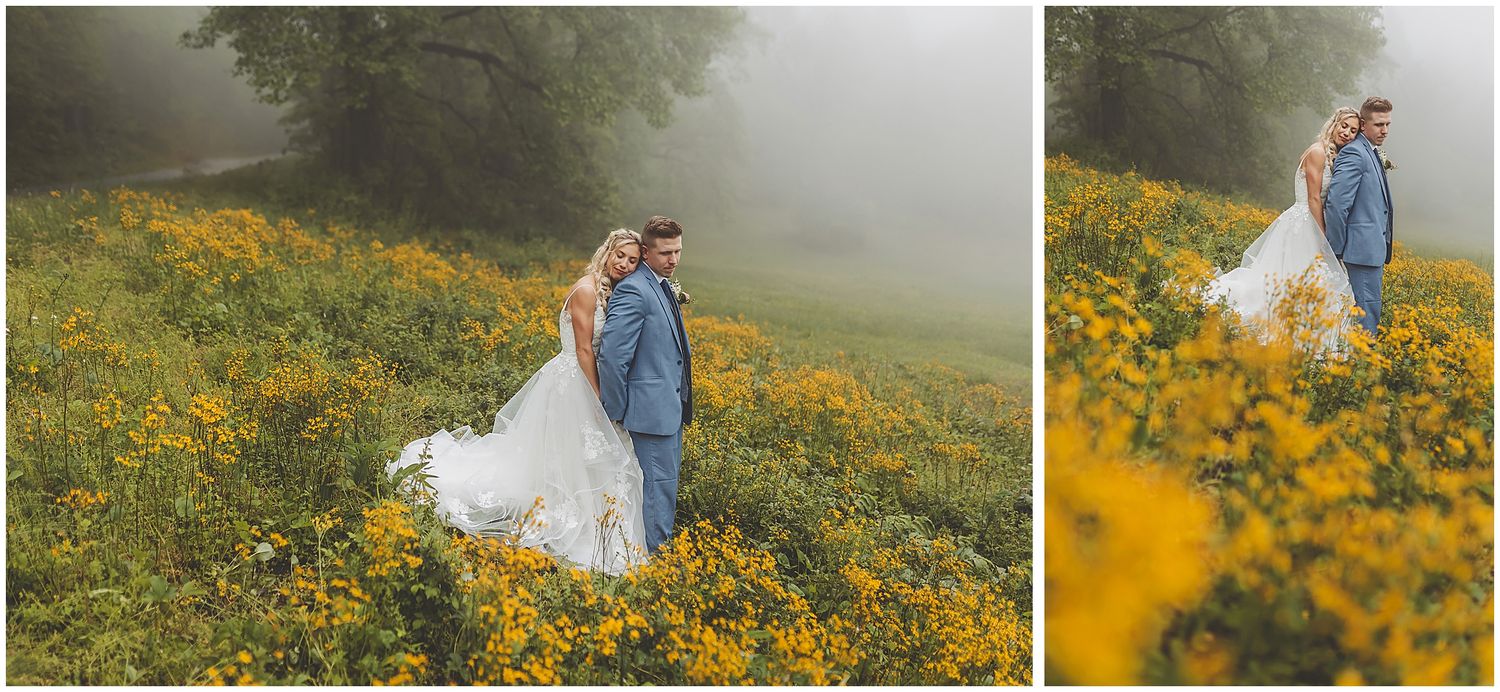 Romantic wedding photos taken in misty field surrounded by golden wildflowers.